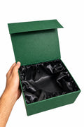 Open green Hayat Scents gift box with black lining